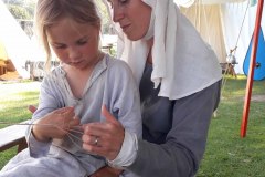 Mother and daughter braiding