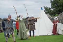 Lady Helen loosens an arrow
